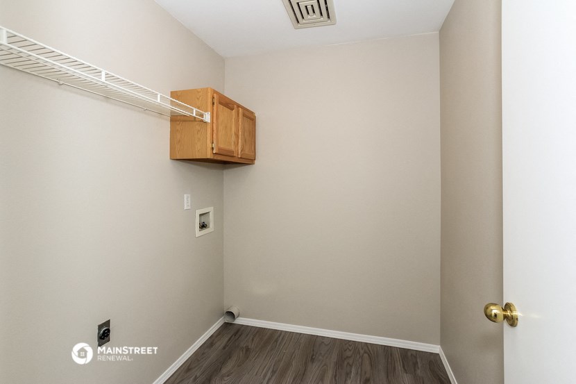 a bedroom with a closet and a shelf on the wall