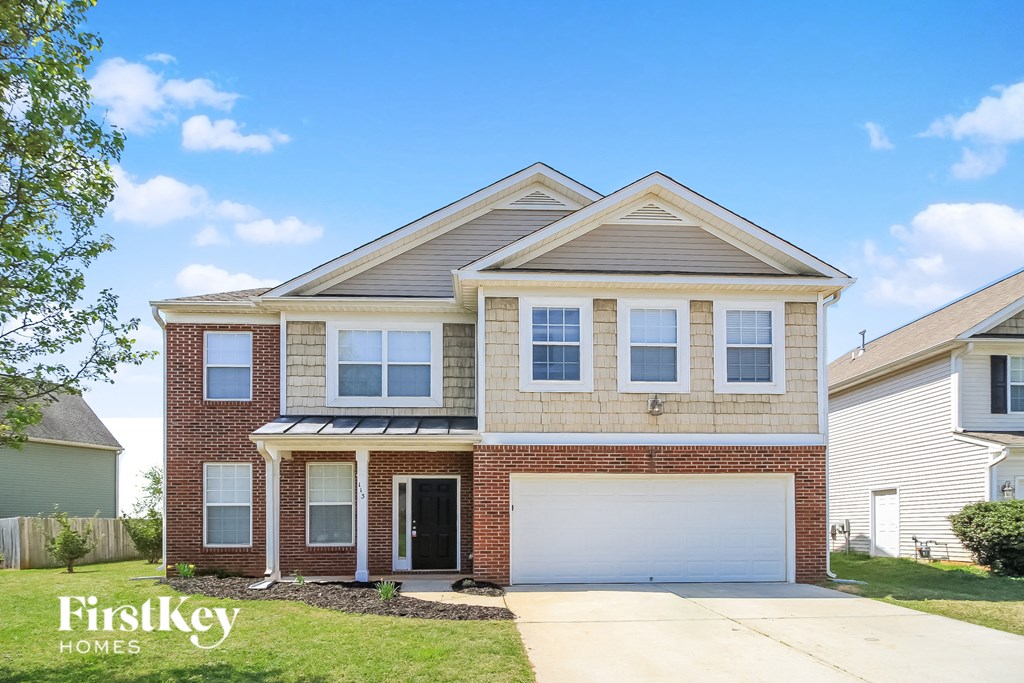 A house with a garage is for sale by FirstKey Homes.