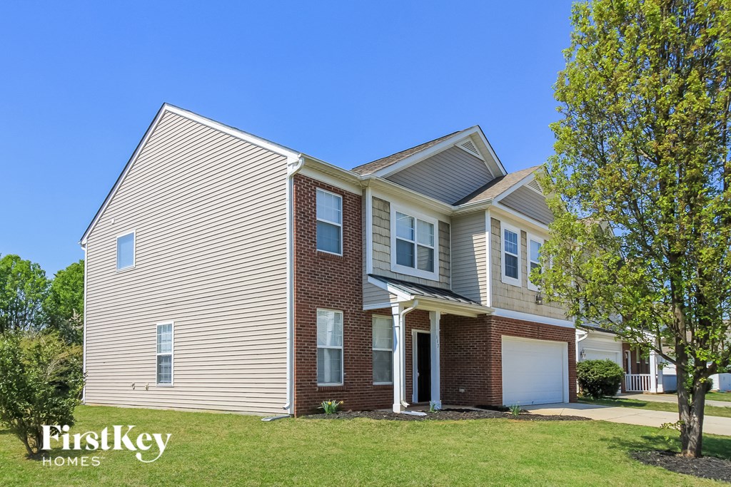 A house with a garage is for sale by FirstKey Homes.
