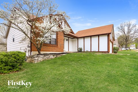 a house with a lawn in front of it