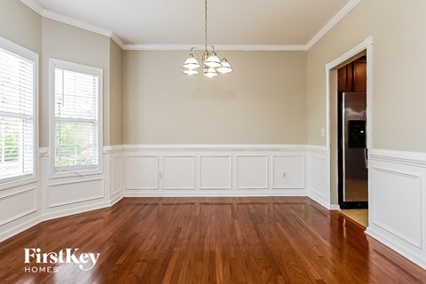 A room with wooden floors and white walls.
