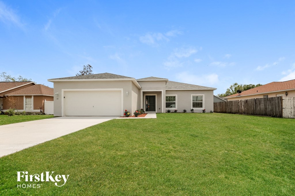 A large house with a garage is for sale.