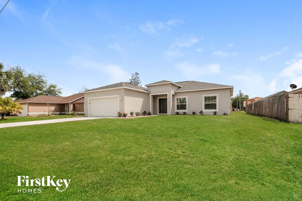 A house with a lawn in front of it is for sale.