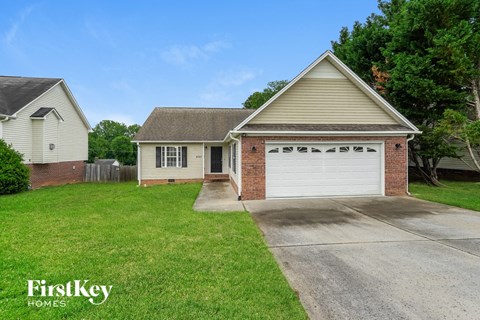 A house with a garage is for sale by FirstKey Homes.