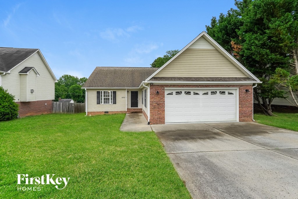 A house with a garage is for sale by FirstKey Homes.