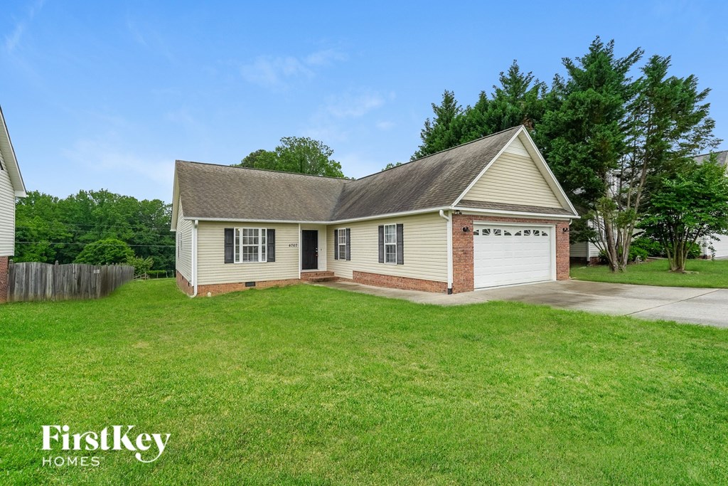 A house with a garage is for sale by FirstKey Homes.