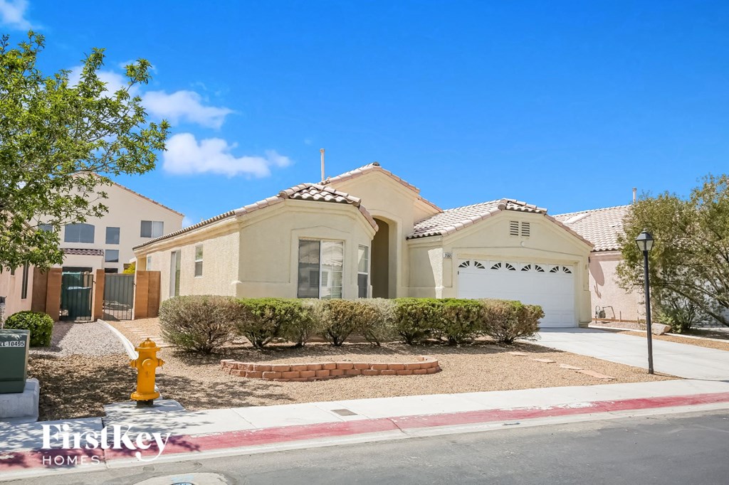a home with a yellow house and a yellow fire hydrant