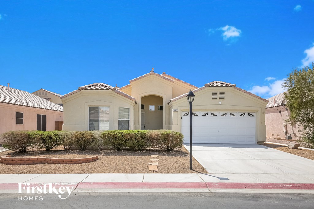 a house with a driveway and a garage door