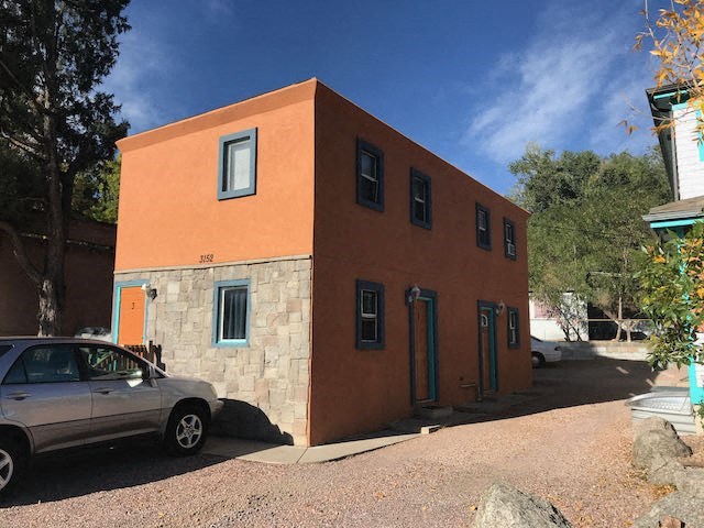 a building with a car parked in front of it