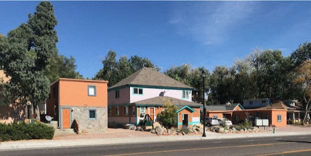 a group of houses on the side of a street