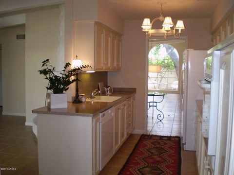 the kitchen is open to the dining room and living room