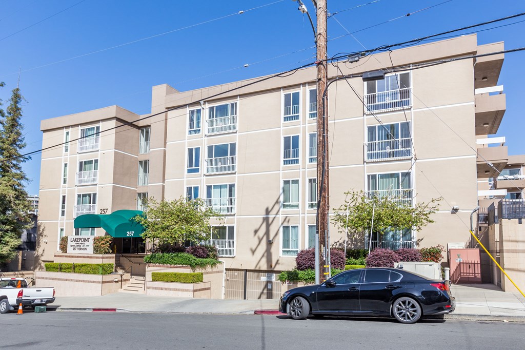 a car parked in front of an apartment building