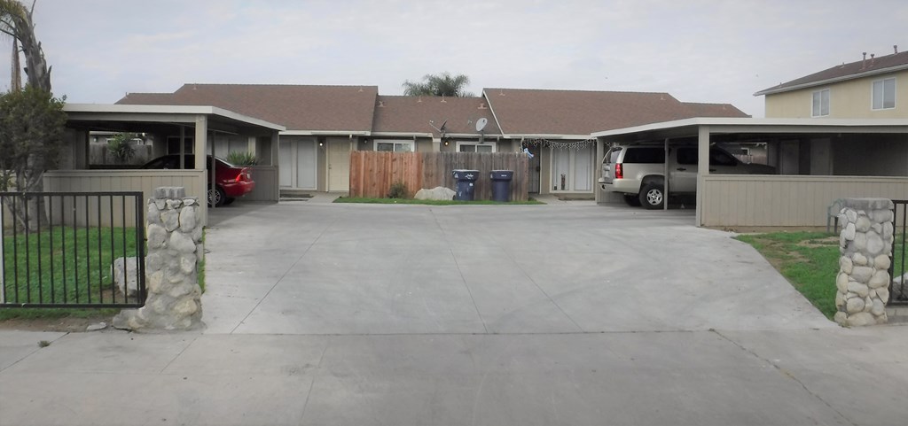 a house with a driveway and a parking lot
