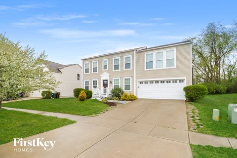 A house with a driveway in front of it.