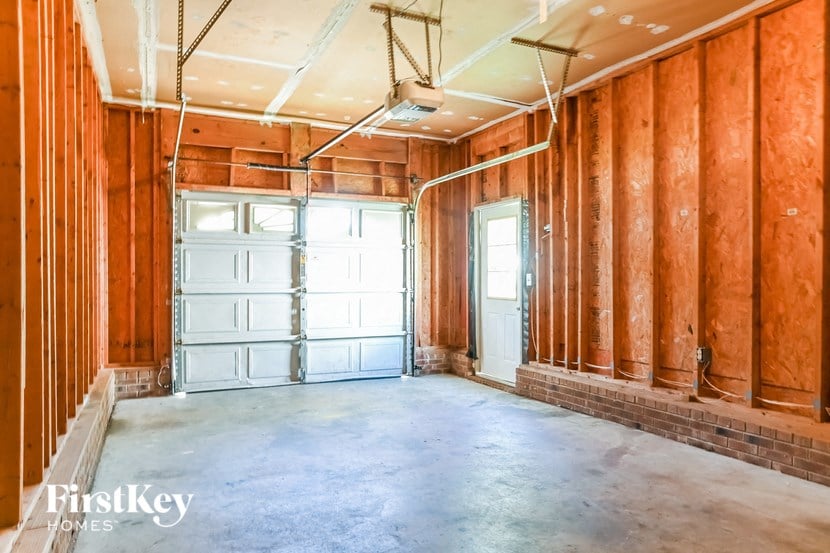 an empty room with a garage door in it