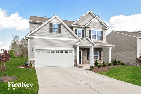 a suburban home with a white garage door