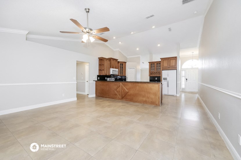 the kitchen is open to the living room and dining room