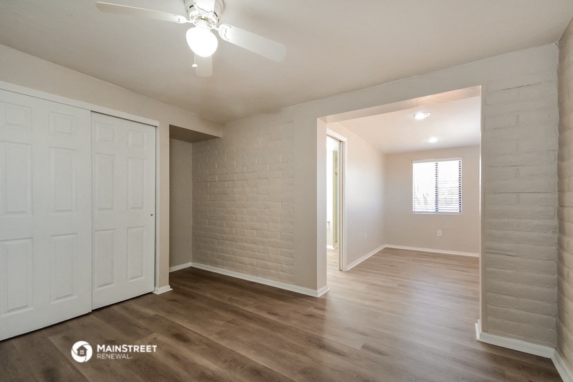 the living room and dining room of an apartment