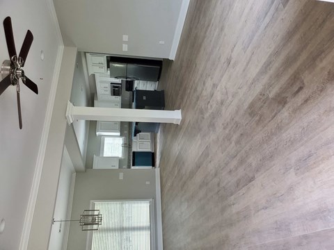 an overhead view of a living room with a ceiling fan