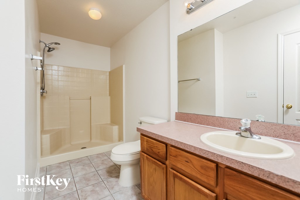 a bathroom with a sink toilet and a shower