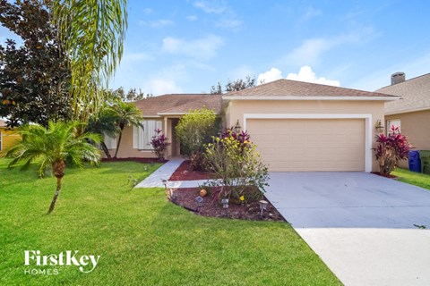 a home with a driveway and a garage door