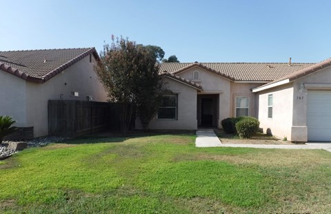 a house with a yard in front of it