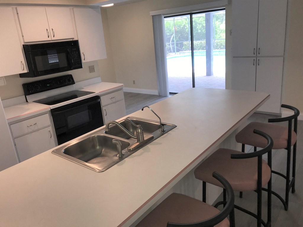 a kitchen with a counter top and a sink