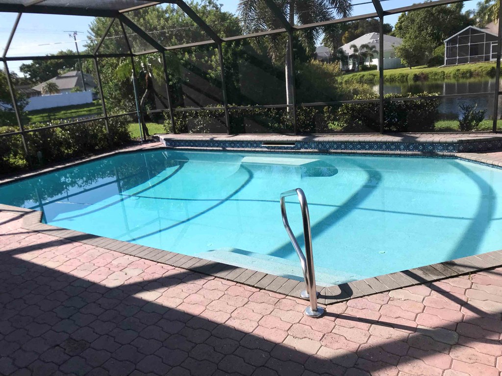 a swimming pool with a fence around it