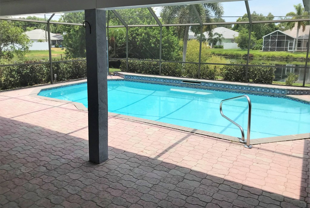 a swimming pool with a fence around it