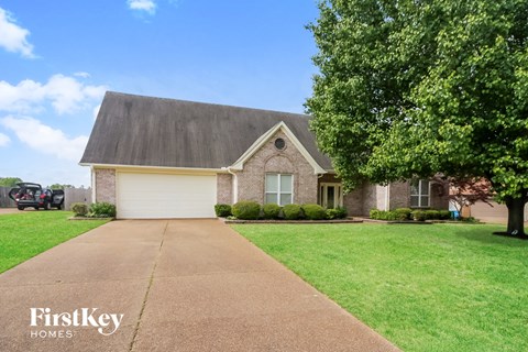 A house with a driveway in front of it.