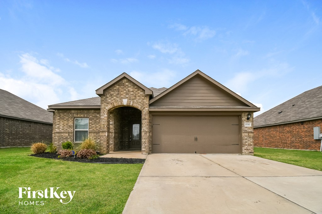 a house with a driveway and a garage door