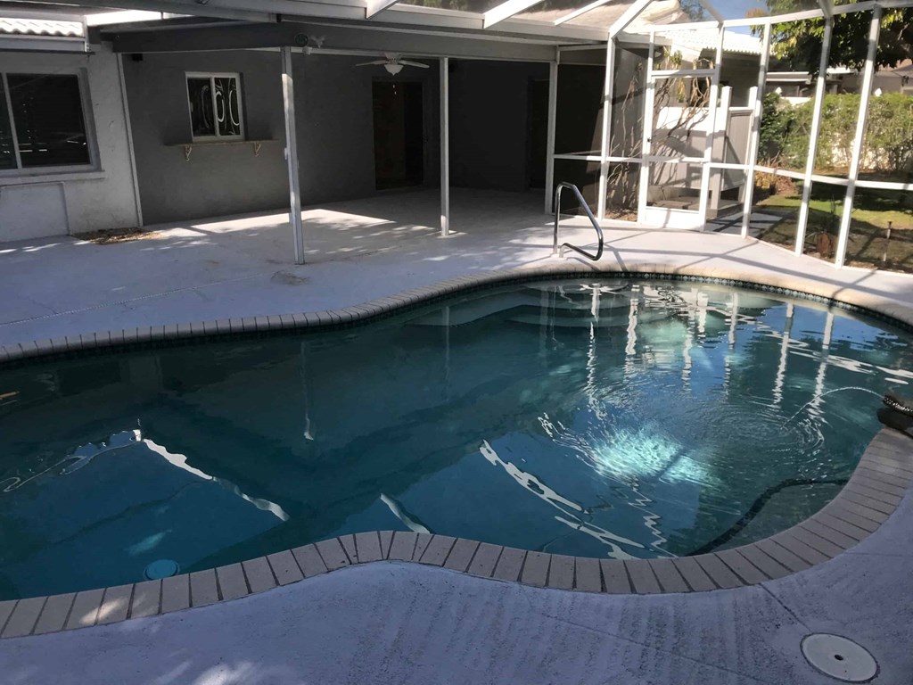 the pool in the back of the house is empty