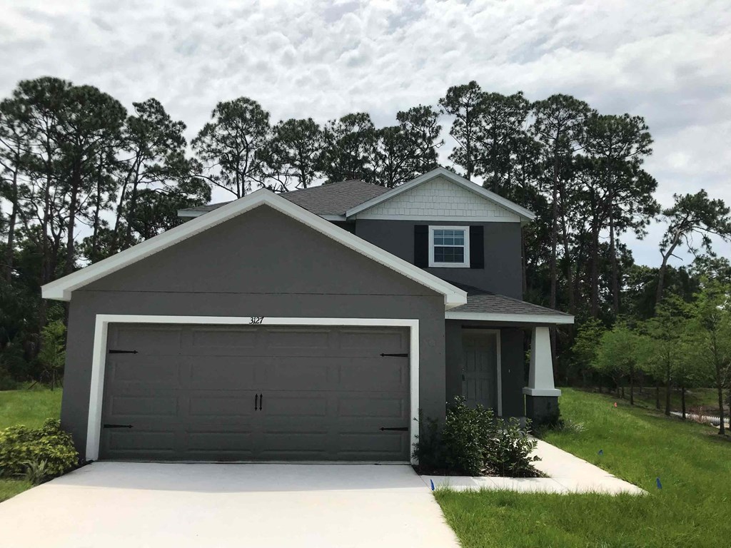 A two-car garage is attached to a house.
