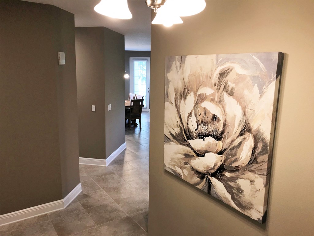 an artwork on a wall in a home hallway