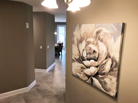 an artwork on a wall in a home hallway