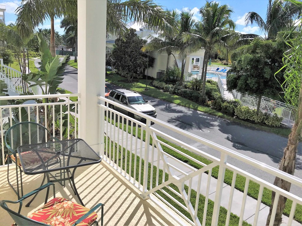 a balcony or terrace with a table and chairs