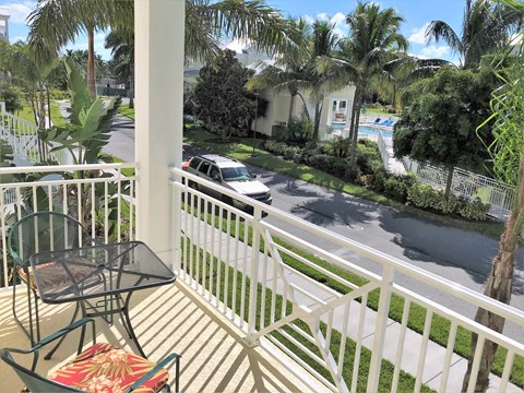 a balcony or terrace with a table and chairs