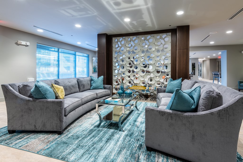 a living room with couches and a coffee table