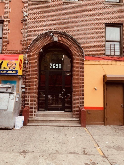 the front door of a brick building with a