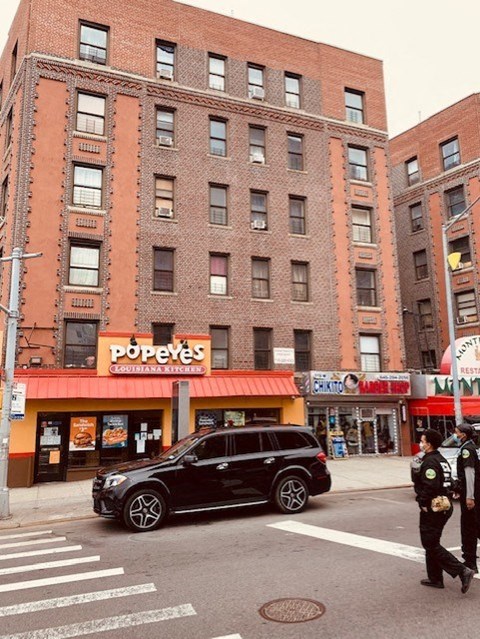 a car parked on the street in front of a building