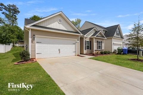 A two-story house with a garage is for sale by FirstKey Homes.