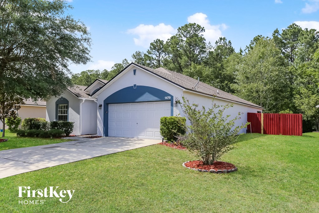 a home with a blue and and a garage