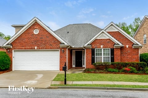 a brick house with a white garage door