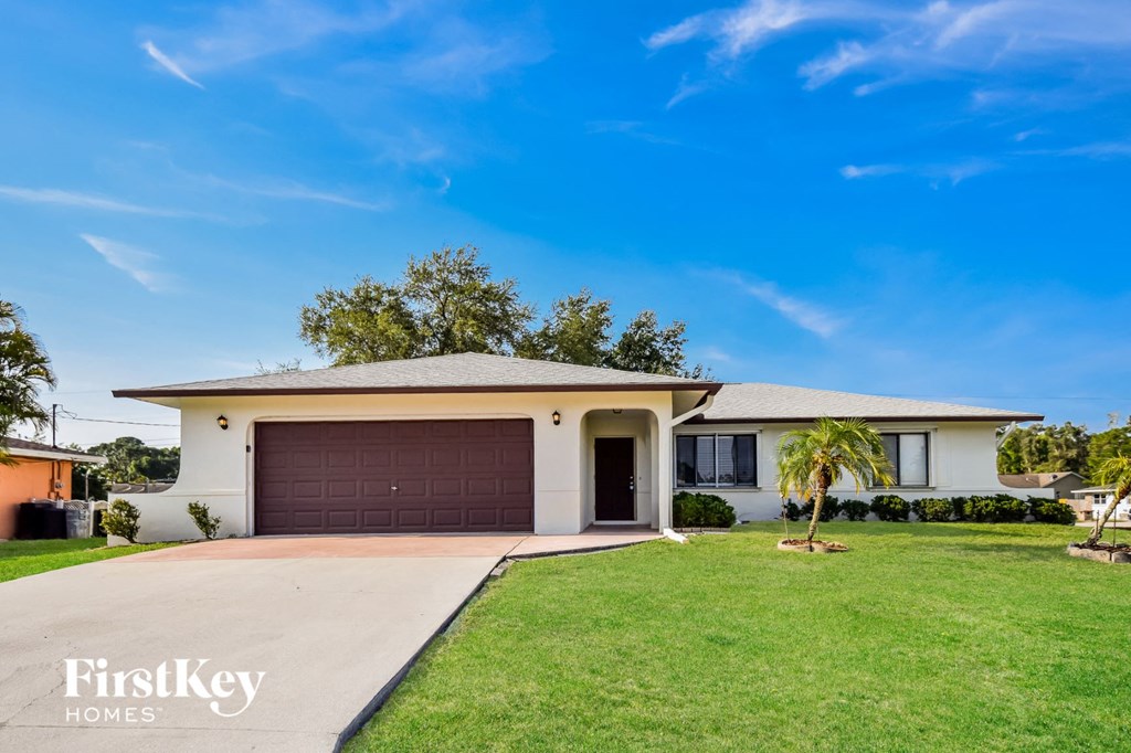 A house with a brown garage door is for sale.