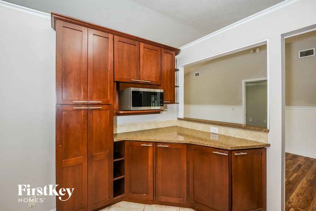 a kitchen with wooden cabinets and a counter top