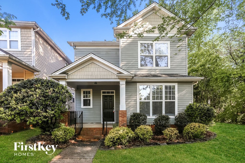 a home with a front porch and a lawn