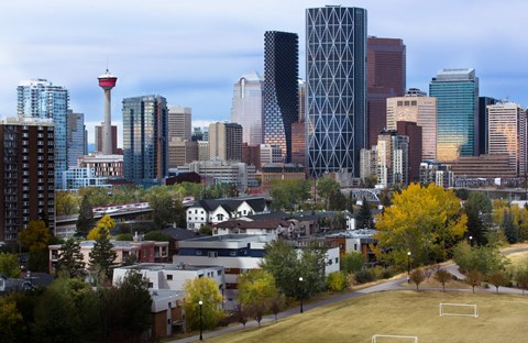 A city skyline with a tall tower in the background.