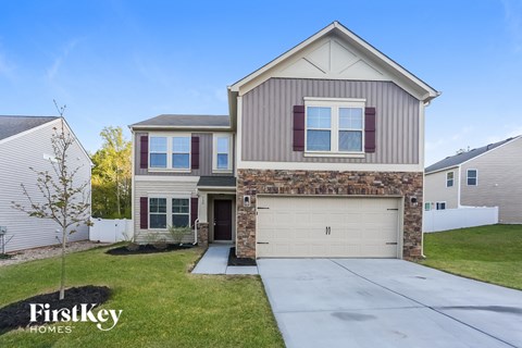 A house with a garage is for sale by FirstKey Homes.