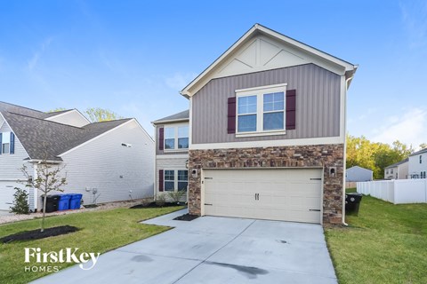 A house with a garage is for sale by FirstKey Homes.