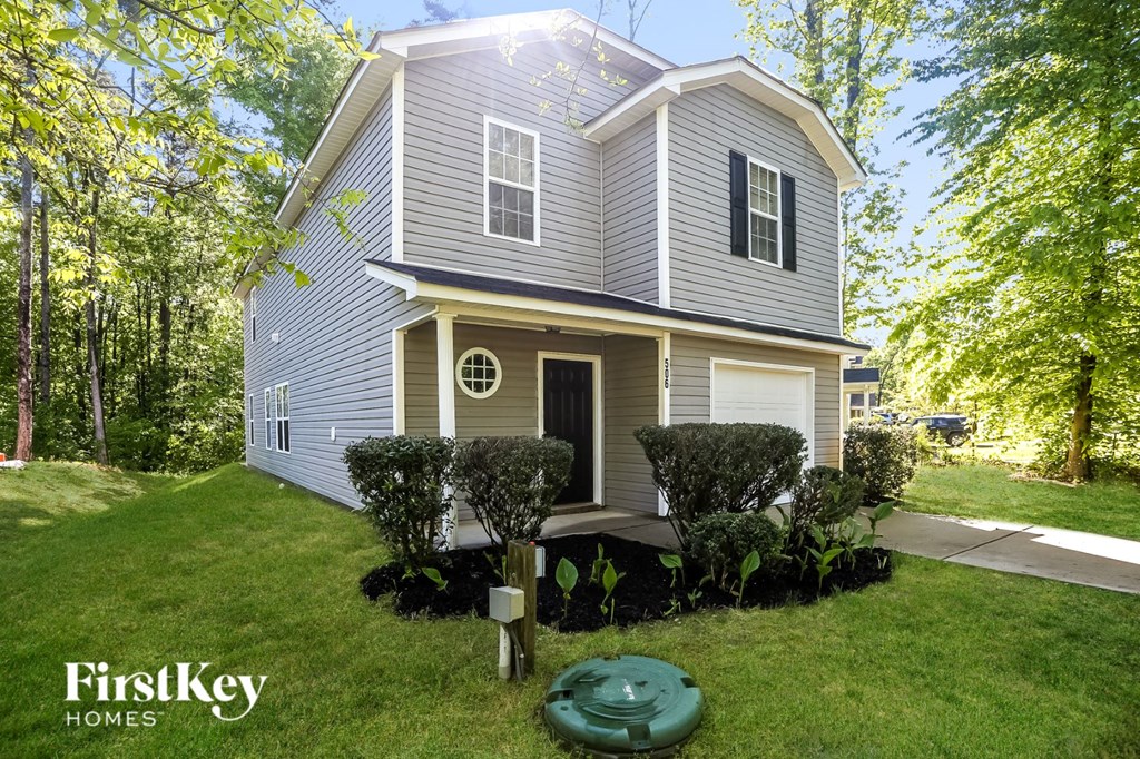 a house with a yard and a fisheye lens view of the front